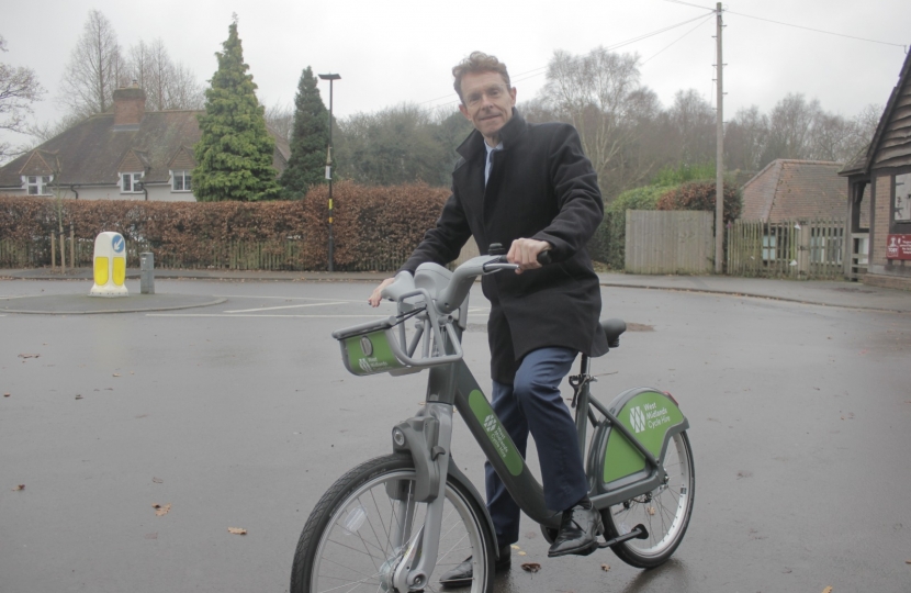 West Midlands Mayor Andy Street with one of the new bike share cycles at Town Gate in Sutton Coldfield