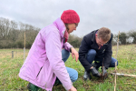 Andy Street, Mayor of the West Midlands is pictured planting a tree with Tara Sexton, volunteer team leader for Canal & River Trust Birmingham.