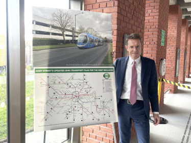 Andy Street unveiling his plans to cap fares across all public transport in the region at University Station in Birmingham.